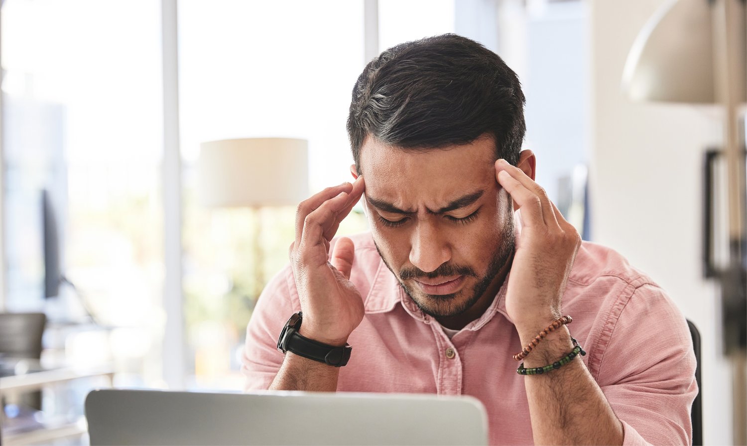 Man holding head in pain